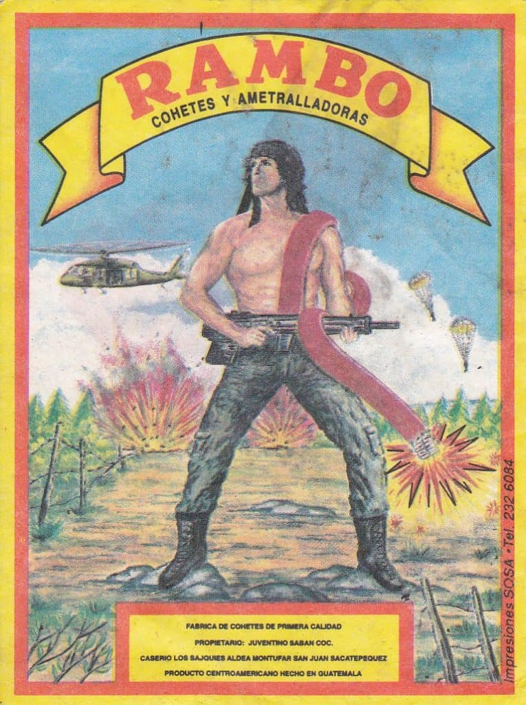 Caza de cohetes y ametralladoras con imagen de un hombre armado en un campo en explosión. – SoyMigrante.com REVISTA