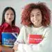 Aprendices de idiomas internacionales con libros de inglés y chino, enfocando en programas de migrantes y formación en nuevos idiomas para mejorar oportunidades laborales y desarrollo personal.