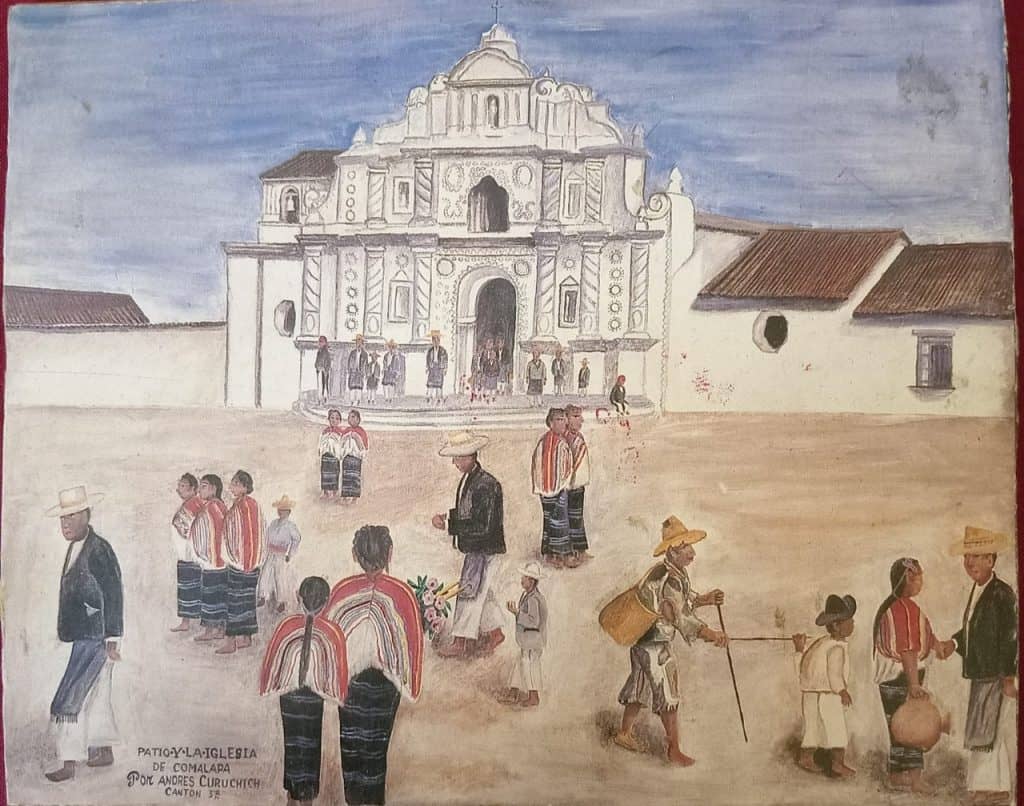 Paisaje de la iglesia de Comalapa con personas vestidas con trajes tradicionales y actividades típicas, destacando la cultura y tradiciones en una comunidad guatemalteca. – SoyMigrante.com REVISTA