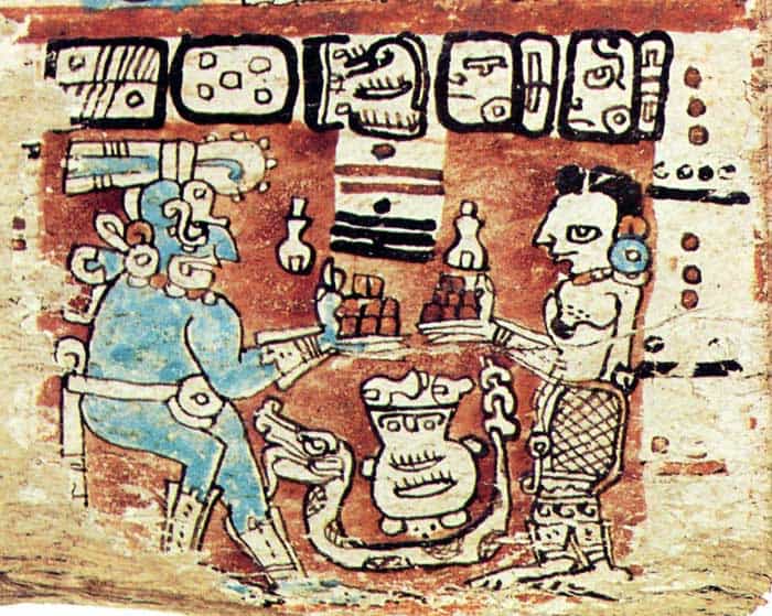 El dios Chac tomando bebida de cacao junto a la madre Tierra, ilustracion contenida en el Códice Maya de Madrid. – SoyMigrante.com REVISTA