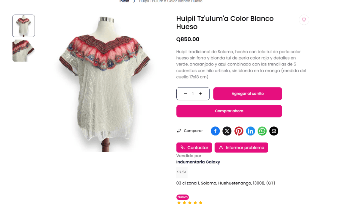 White traditional huipil blouse with colorful embroidered yoke on a mannequin stand