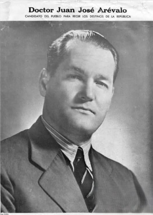 Portrait of Dr. Juan José Arévalo in a suit and tie, a historical campaign photo with his name visible above.