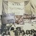 Historical collage: a banner reading 'Viva Guatemala' amid vintage newspaper clippings and black-and-white protest photos.