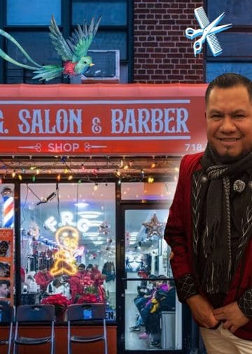 Smiling man in a red jacket standing outside a barber shop; a colorful bird flies across the storefront and a scissors-and-comb graphic hovers nearby.